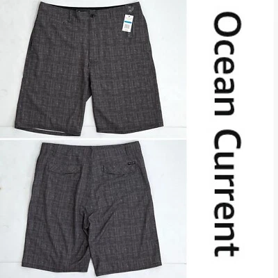 Pantalones cortos de tabla anfibios Ocean Current para hombre nuevos con etiquetas talla 36 negros/grises  Foto 1 de 4
