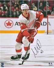 Moritz Seider Detroit Red Wings Signed 16x20 Skating with Puck Photograph