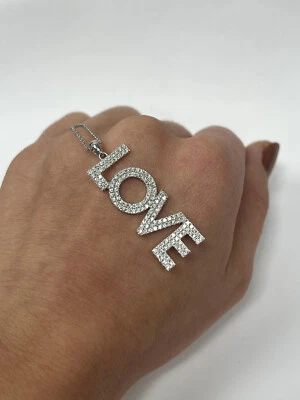 Features 1.43CT Brilliant Round Cut Lab-Created Diamonds 935 Silver LOVE Pendant - Image 1 of 4