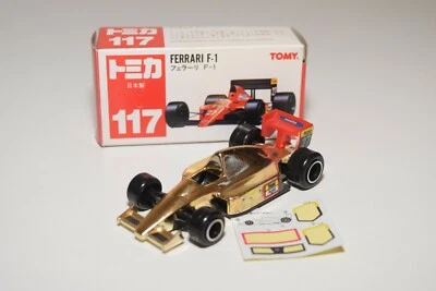 V 1:55 TOMICA TOMY 117 FERRARI FORMULA 1 RACING CAR GOLD NEAR MINT BOXED RARA - Immagine 1 di 4