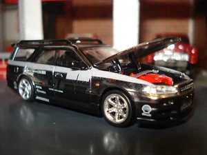 NISSAN STAGEA EDITION 1/64 POP RACE CERCHI A RAGGI CROMATI E PNEUMATICI REAL RIDER - Foto 1 di 4
