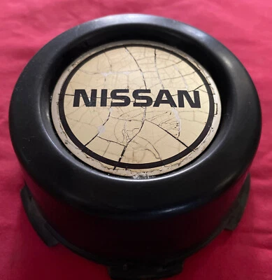 Tapacubos central rueda camioneta Nissan Pathfinder 1986 1987 1988 - 1995 OE Foto 1 de 4