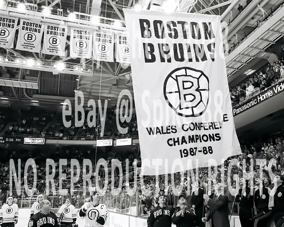 RAY BOURQUE BOSTON BRUINS RAISES BANNER AT OLD BOSTON GARDEN 1987-1988 8X10 - Image 1 of 1