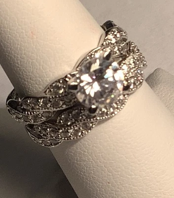 Round Cz  Center Stone Surrounded By Channel Set Cz’s  (1144) Size 7 - Image 1 of 4