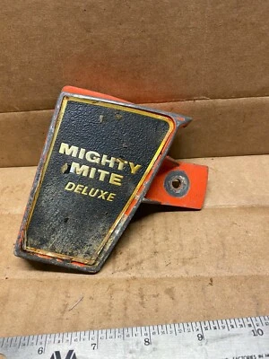 A used clutch cover from a Remington Mighty Mite Deluxe Chainsaw - Image 1 of 4