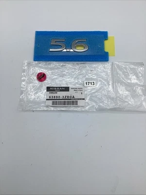 NEW OEM 2014 - 2020 Infiniti QX80 5.6 Front Fender Emblem 63890-3ZD0A - Image 1 of 2