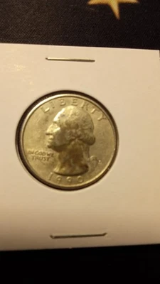 1990 D error Quarter  Black face Washington-in cod we trust - Image 1 of 2