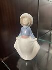 NAO by Lladro  "Little Girl Picking Up Her Skirt? Figurine -