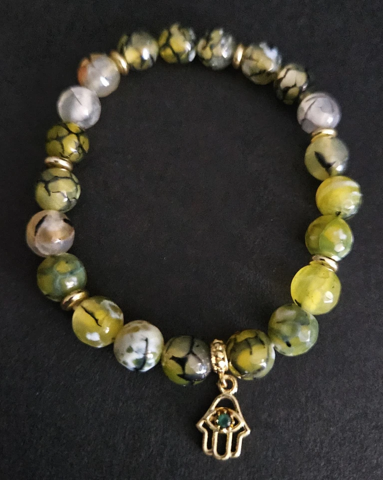 Pulsera elástica Shivam con piedras preciosas de ónix y latón Hamsa Charm Foto 1 de 1