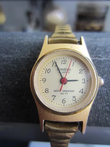 Reloj para mujer Armitron 21MM esfera marfil tono dorado 6" banda elástica fecha batería nueva - Imagen 1 de 3
