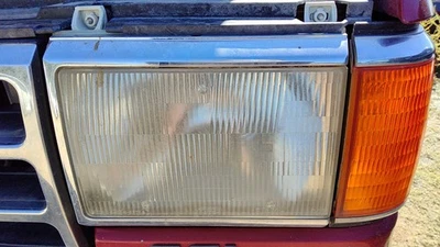 Luz de cabeza izquierda para conductor F150 1987-91 OEM lámpara delantera con intermitente moldura cromada Foto 1 de 3