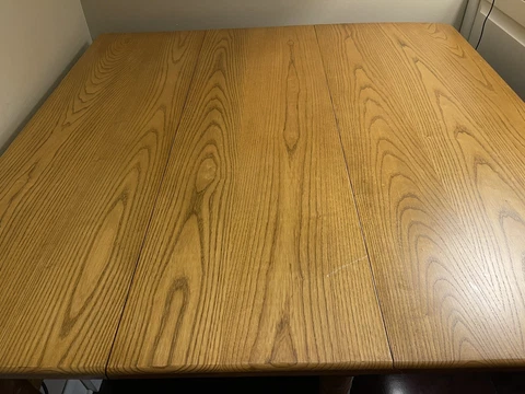 Amish made dropleaf table. Solid Oak. 27”-133” Four slatback chairs.6-12” leaves Cover