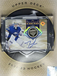 2023-24 Upper Deck Ultimate Emblems Rookie Auto Gold DEVON LEVI Sabres 93/99 - Picture 1 of 2