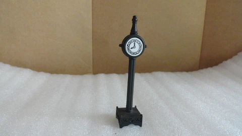 Small metal clock figurine Cover