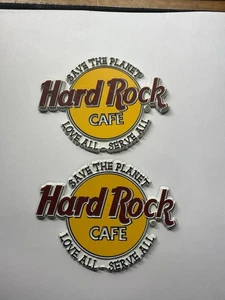 Lot 2 Hard Rock CAFE YELLOW RUBBER SAVE THE PLANET FRIDGE MAGNET LOVE SERVE ALL - Picture 1 of 4