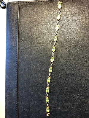 14K Yellow Gold bracelet with Diamonds and Peridot gemstones - Image 1 of 3