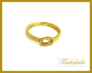 14K KNOT RING IN YELLOW GOLD HIGH POLISHED MADE IN USA. - Picture 1 of 3