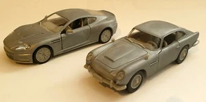 JAMES BOND: PRIMER DISPARO ASTON MARTIN DBS & DB5 MODELOS DE METAL CRUDO + PLACA DE PÓQUER - Imagen 1 de 12