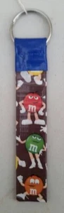 M&M Caramelos Llavero Cinta Conducta Hecho a Mano Cordón Lazo Caramelo - Imagen 1 de 3