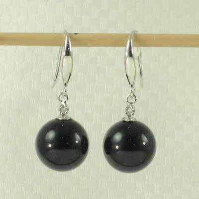 Pendientes de gancho de ónix negro con diamantes brillantes de oro blanco de 14K Foto 1 de 3