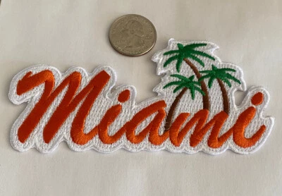 2- PARCHES VINTAGE DE HIERRO SOBRE BORDADOS “MIAMI” FLORIDA Aprox 4”x2” NARANJA. Foto 1 de 3