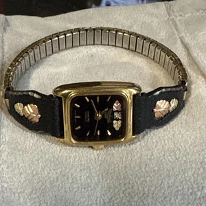 Orig Black Hills Diamond Damen 18mm Black Uhr 12K Gold Blätter Engel - läuft - Bild 1 von 23