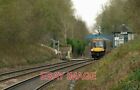 PHOTO  BIRMINGHAM-BOUND A CLASS 170 DIESEL UNIT PASSES THE SITE OF KETTON AND CO