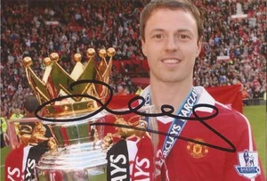 MAN UNITED: JONNY EVANS SIGNED 6x4 PREMIER LEAGUE TROPHY PHOTO+COA - Picture 1 of 1