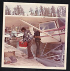 Old Vintage Photograph Man Carrying Ice Chest on Dock Near Seaplane in Water