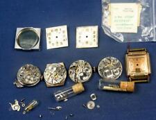 F 38.  4 VINTAGE GENTS WRIST WATCH MOVEMENTS AND A VINTAGE BULOVA CASE & DIAL ON