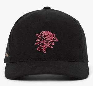 Gorra ajustable Travis Mathew PASSPORT HAT rosa - negra - TOTALMENTE NUEVA - Imagen 1 de 8