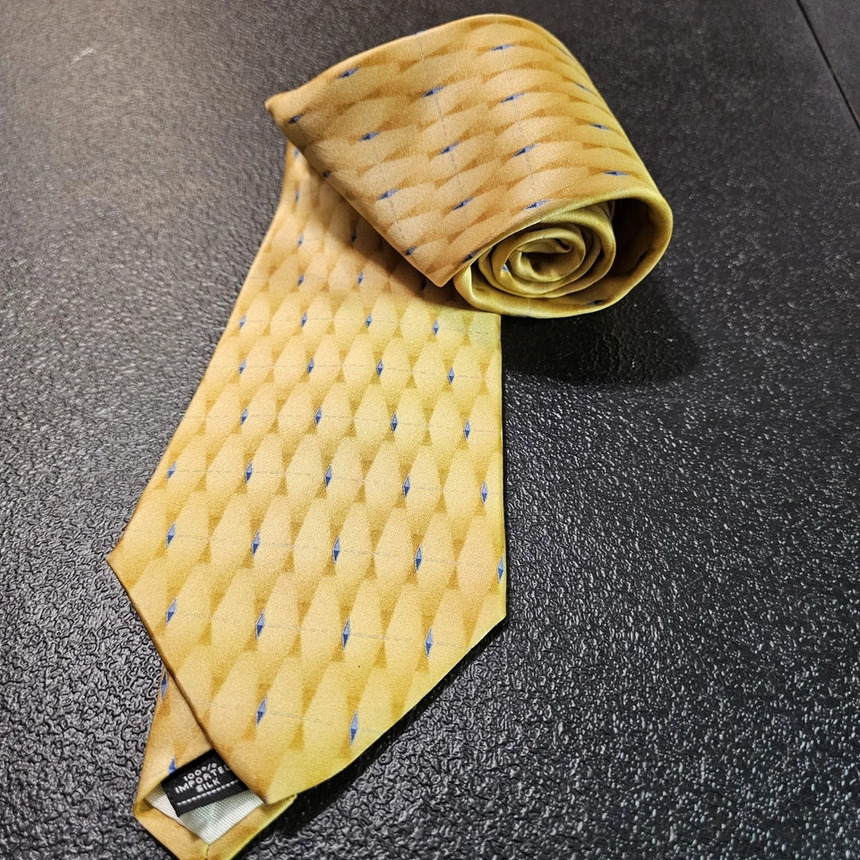 Corbata geométrica Zylos Gold de George Machado 100 % seda oro y detalles azules Foto 1 de 4
