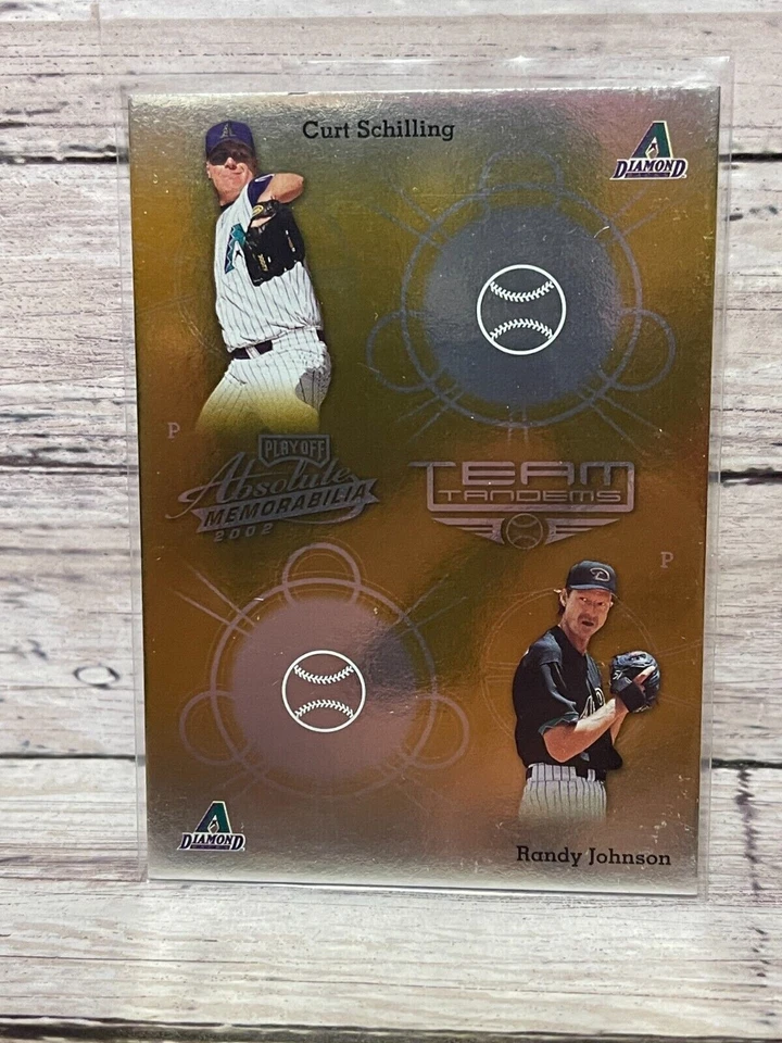 2002 Absolute Memorabilia #TT2 RANDY JOHNSON/SCHILLING Team Tandems Gold (1:72) - Image 1 of 1