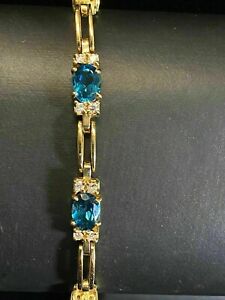 8Ct Oval Cut Simulated Blue Topaz Charm Tennis Bracelet 14K Yellow Gold Plated