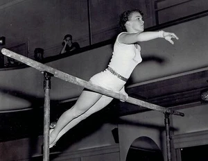 1954 Vintage Photo gymnast Ernestine Russell on parallel bars AAU Championships - Picture 1 of 2