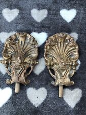 A PAIR OF VINTAGE FRENCH METAL CURTAIN HOLD