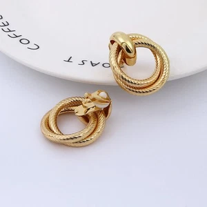 Clip on 1 1/2" gold textured loose knot button style earrings - Picture 1 of 2