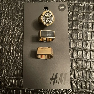 Juego de 3 anillos H&M pequeños/medianos joyas de moda dorados negros Foto 1 de 4