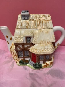 VILLAGE TEA-POT COLLECTABLE CERAMIC HANDPAINTED BY ANNIE ROWE. CHIP ON SPOUT - Picture 1 of 11