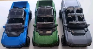 Hot Wheels - 3 x Loose GMC Hummer EV - Green, Blue and Grey Barbie - Picture 1 of 6
