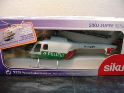 WOW EXTREMADAMENTE RARO #2531 helicóptero BO105 1974 policía de Dusseldorf nuevo en caja 1:55 Siku Foto 1 de 4