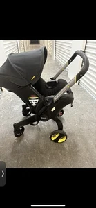 Asiento de coche infantil Doona y base de cierre - Asiento de coche para cochecito (edición medianoche) - Imagen 1 de 13