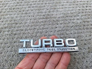 Chrysler OEM 1984-1991 LeBaron Turbo Electronic Fuel injection Emblem Badge Logo - Picture 1 of 3