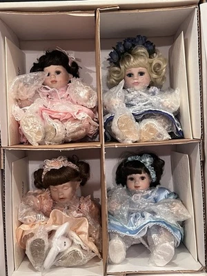 Marie Osmond Porcelain Tiny Tot Collector Dolls Set of 4 NEW in Box - Image 1 of 4