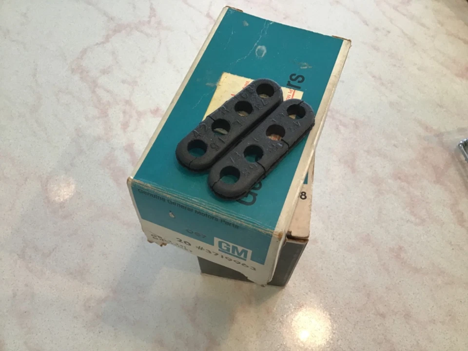 56-82 Corvette 4 Hole Ignition Shield Spark Plug Wire Grommet-GM #3719963--NOS - Image 1 of 1