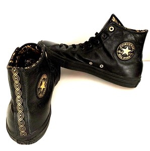 black and gold leather converse