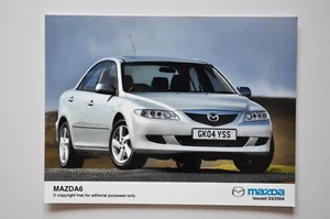 Foto de prensa de coche - Mazda 6 2004 - metálico - vista lateral/frontal - Imagen 1 de 1