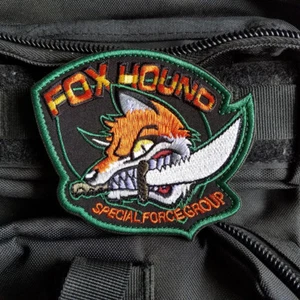 METAL GEAR SOLID MGS FOX HOUND SPECIAL FORCE GROUP "CRAZY FOX" PATCH BADGE GOLD - Picture 1 of 5