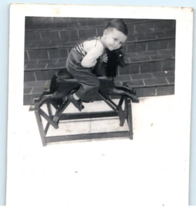Vintage Photo 1944, Little boy snuggled up to rocking horse, 4.5x3 - Picture 1 of 2