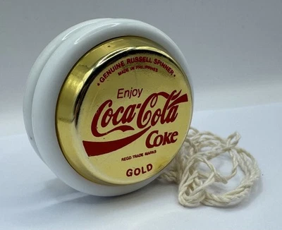 Genuine Russell Spinner Yo-Yo - Coca-Cola Gold + Stand.  - Image 1 of 4